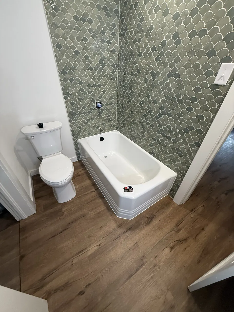 Alternate view of the refinished antique cast-iron bathtub in Nacogdoches, Texas.