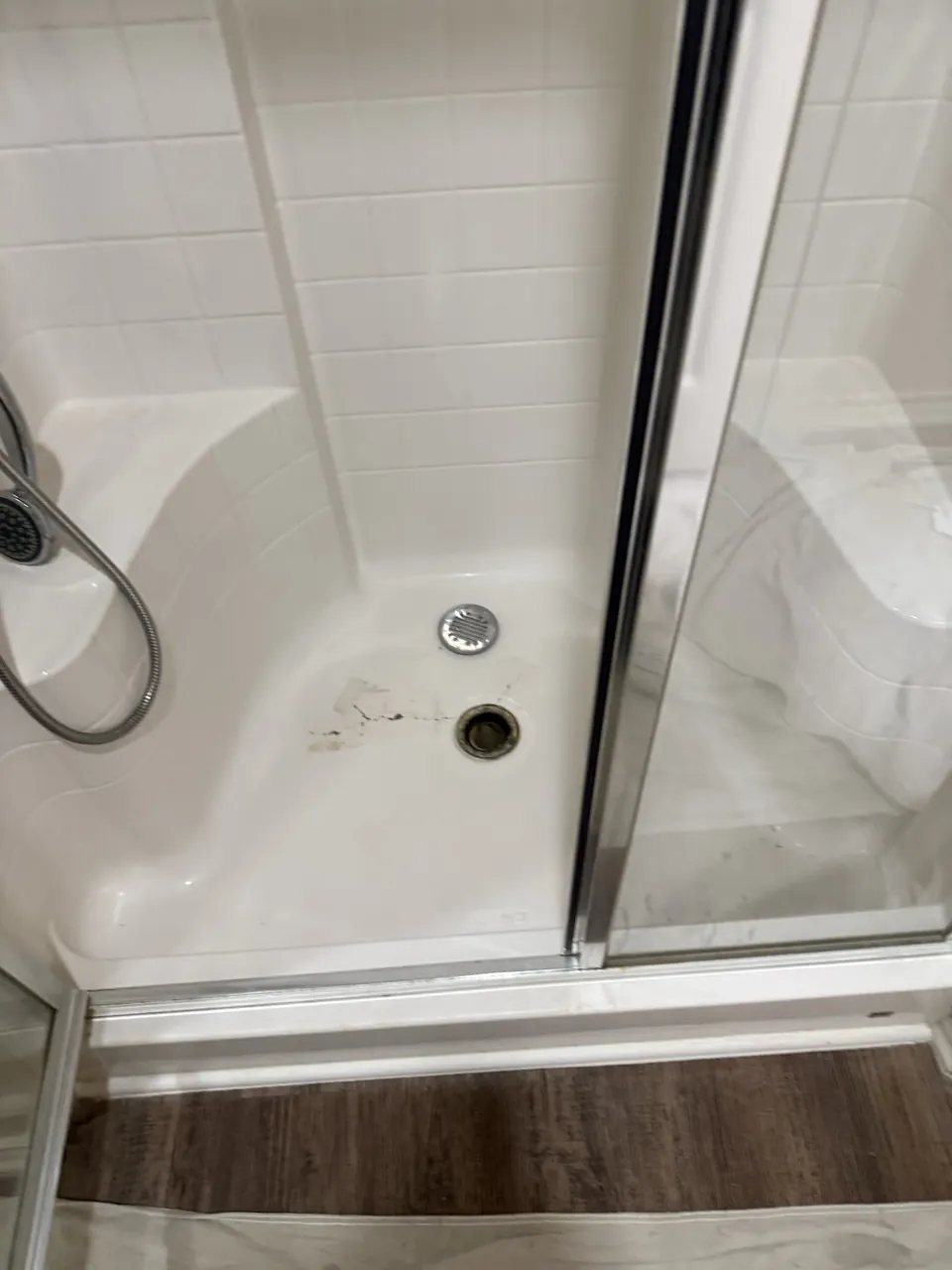 Shower base with damaged drain area