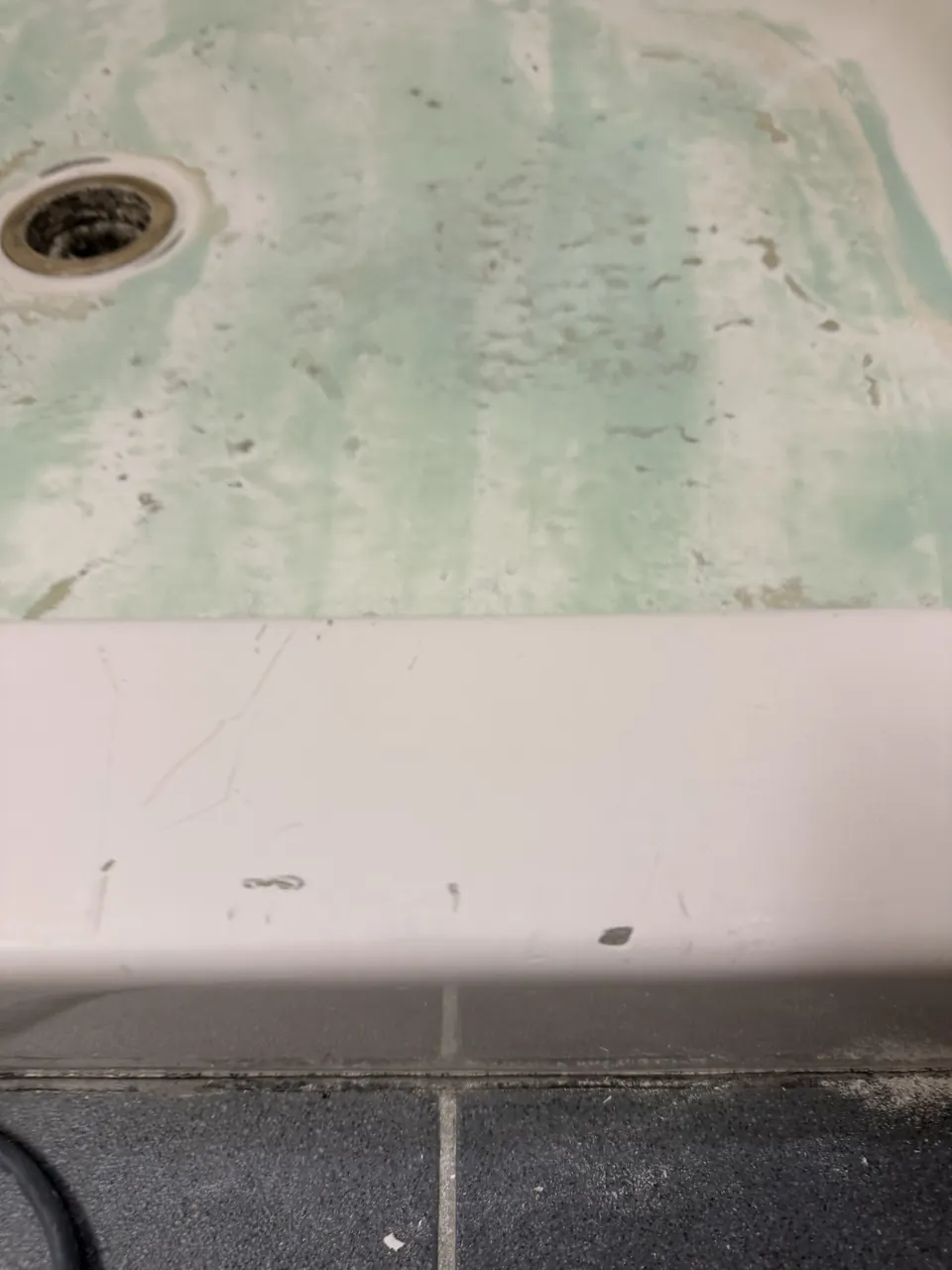 Shower base with exposed surface during work