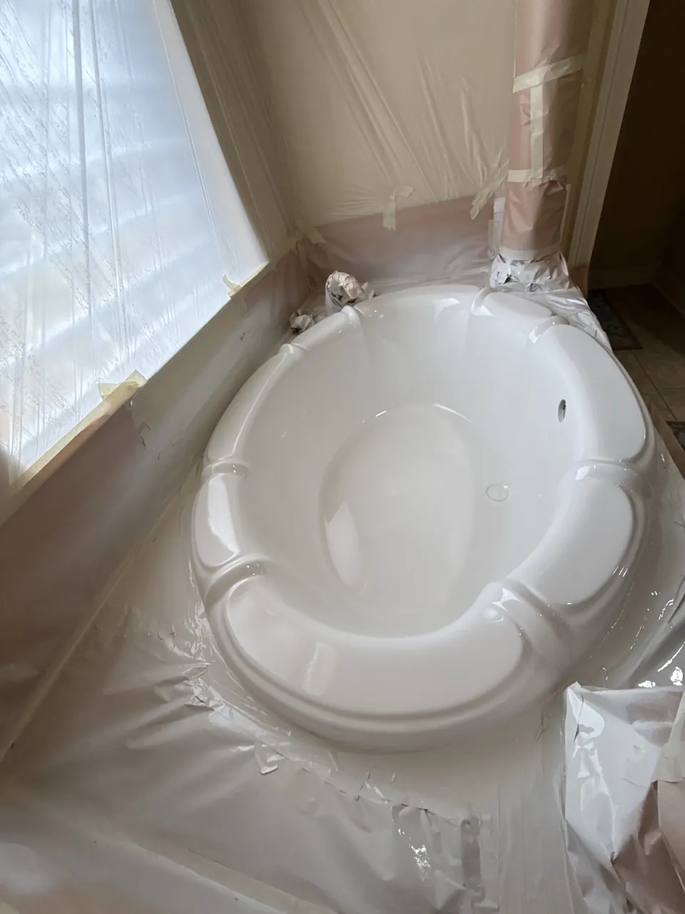 Oval garden bathtub with surrounding masking