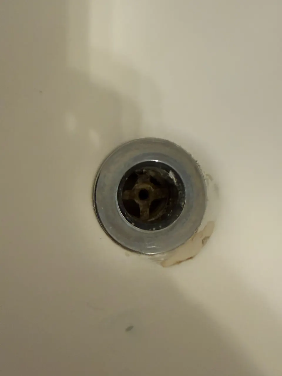 Close view of bathtub drain opening